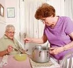 Elderly woman having daughter cooking